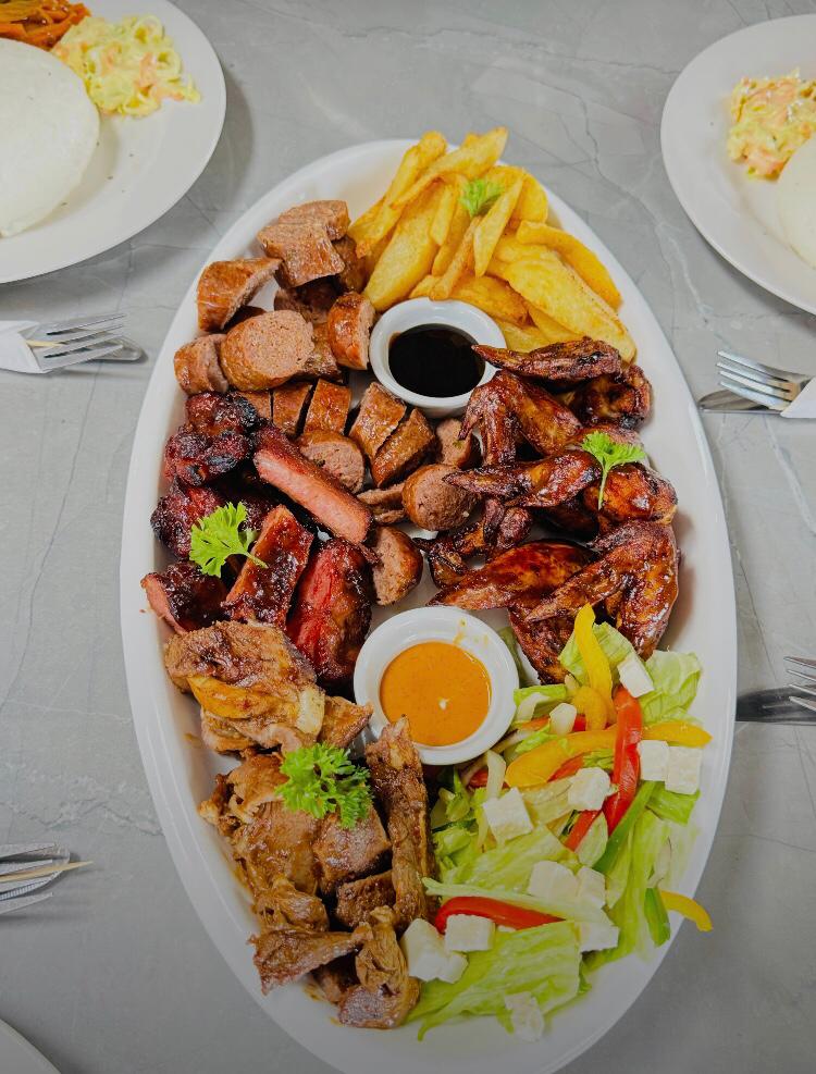 A large platter for four with a variety of snacks