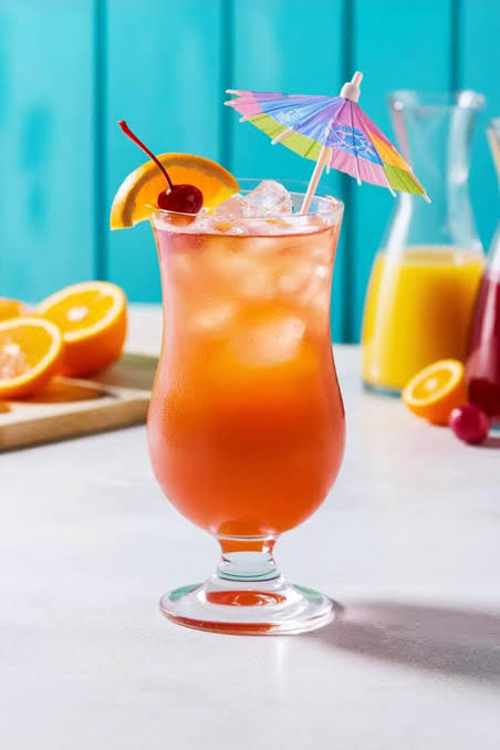A glass of Sex on the Beach cocktail with orange and cranberry juice